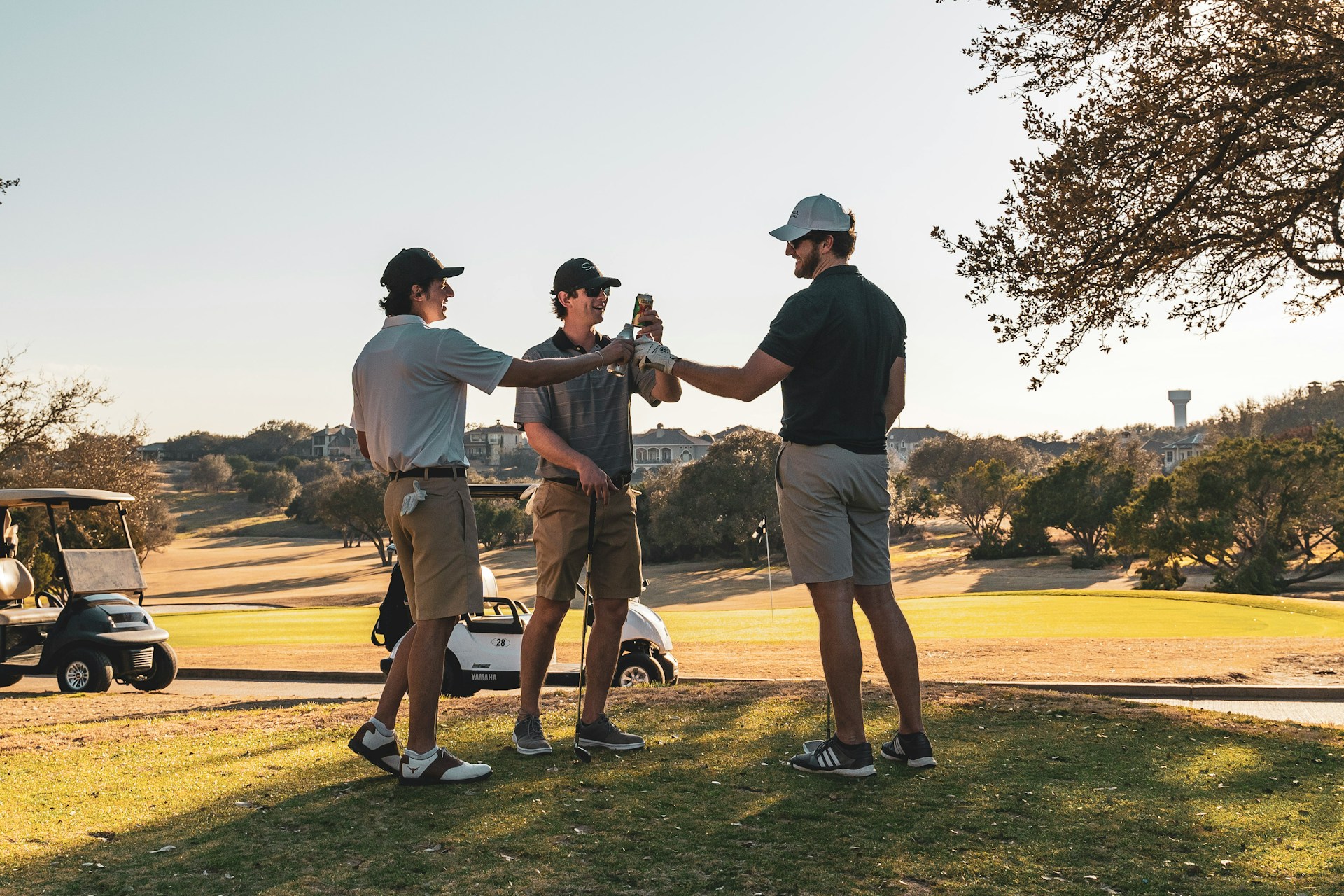 Golfers on a Costa Blanca course beside their buggies