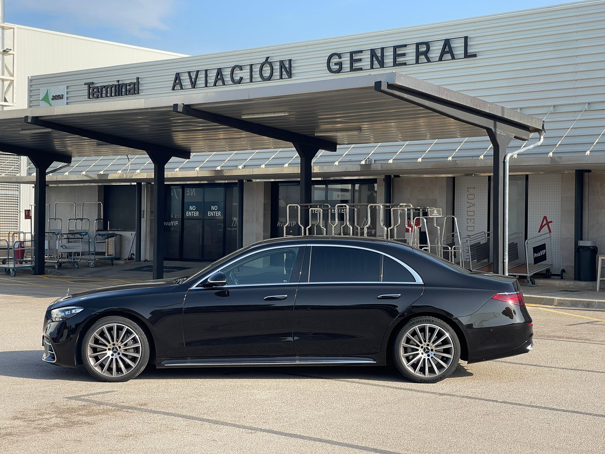 Mercedes S-Class with chauffeur waiting at the general aviation terminal